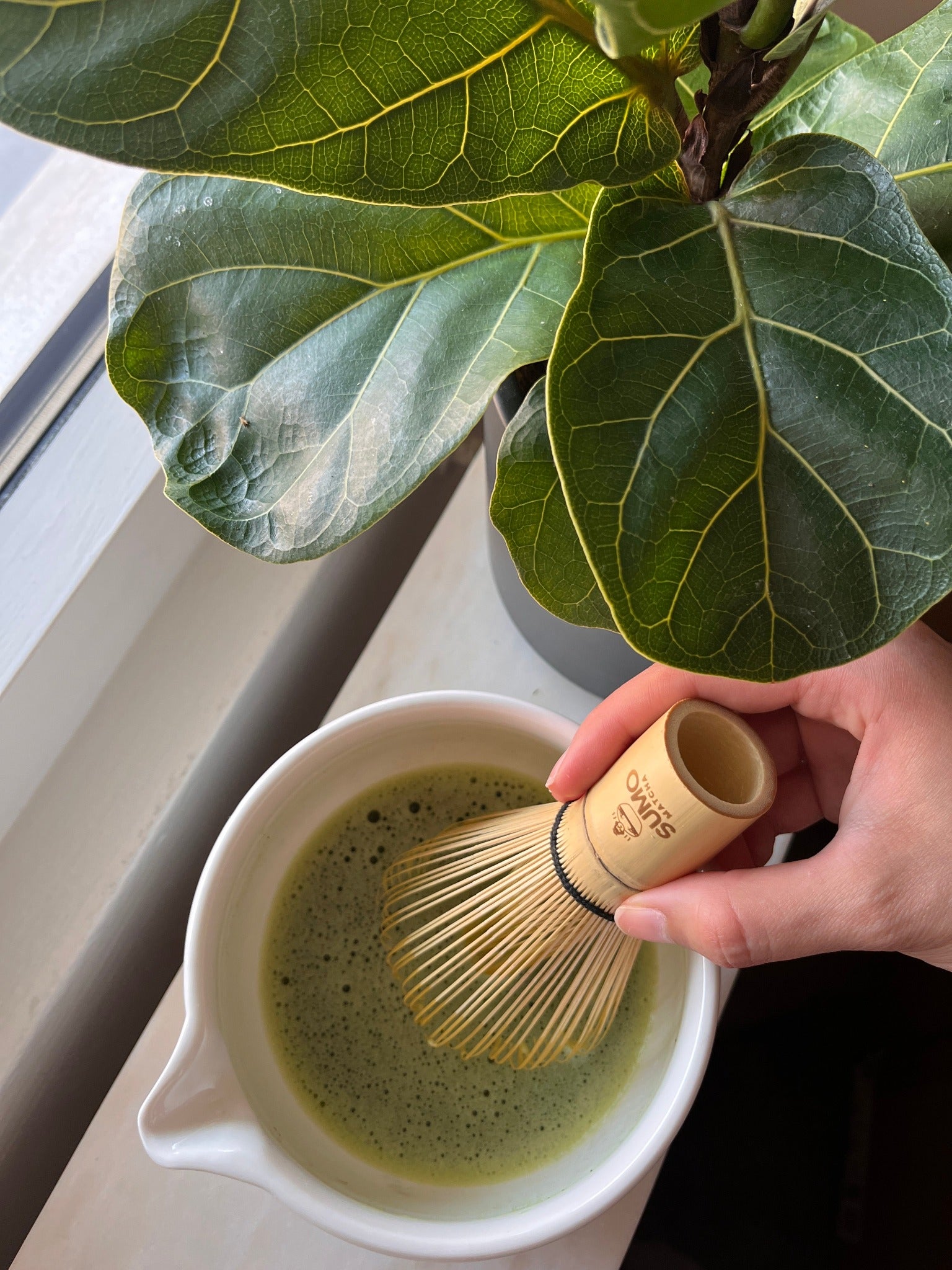 Whisking matcha with our bamboo whisk