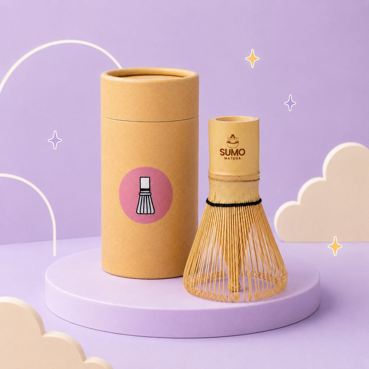 Bamboo whisk and cylindrical container with 'SUMO Matcha' branding on a purple background